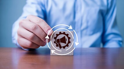 Marketing automation process with megaphone and gear icon on wood block