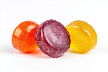 Three Candies Close Up Photography: Colorful Hard Candies, Vibrant Orange, Red, and Yellow Candies Isolated on White, Tempting Sweet Treat, Delicious Sugar Snack