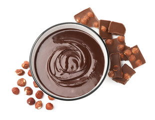 Melted chocolate in bowl, pieces and nuts isolated on white, top view