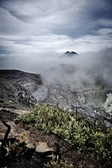 Kawah Ijen under a heavy, milky sky