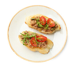 Delicious bruschettas with tuna, tomatoes and arugula isolated on white, top view