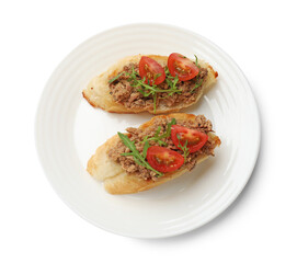 Delicious bruschettas with tuna, tomatoes and arugula isolated on white, top view