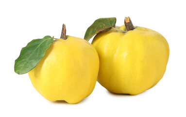 Fresh ripe quinces with green leaves isolated on white