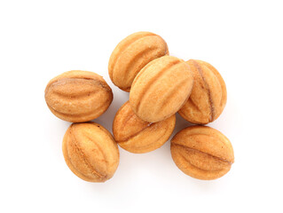 Delicious nut shaped cookies with boiled condensed milk isolated on white, top view