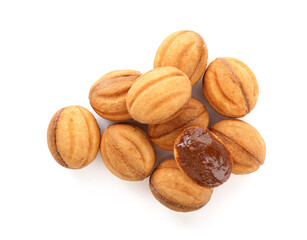 Delicious nut shaped cookies with boiled condensed milk isolated on white, top view
