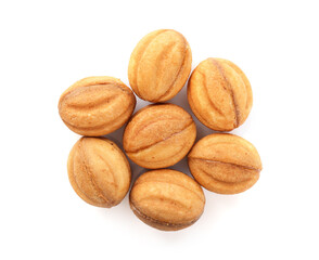 Delicious nut shaped cookies with boiled condensed milk isolated on white, top view