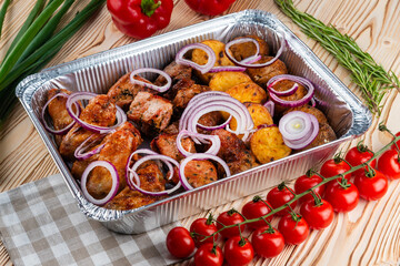 Grilled meat set, shashlik on a wooden table