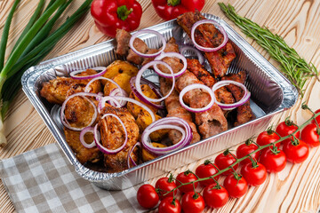 Grilled meat set, shashlik on a wooden table