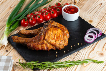 Grilled pork ribs, shashlik on a wooden table