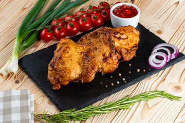 Grilled chicken shashlik on a wooden table