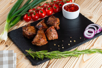 Grilled pork neck, shashlik on a wooden table