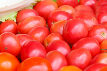 Ripe tomatoes in a fresh vegetable shop