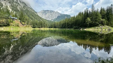Wanddecoratie Reflectie Mountain reflected in a crystal-clear lake, serene landscape photography with peaceful vibes  © Lisa