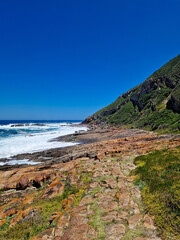 Scenic view of the rocky coastline at Robberg Nature Reserve, South Africa.