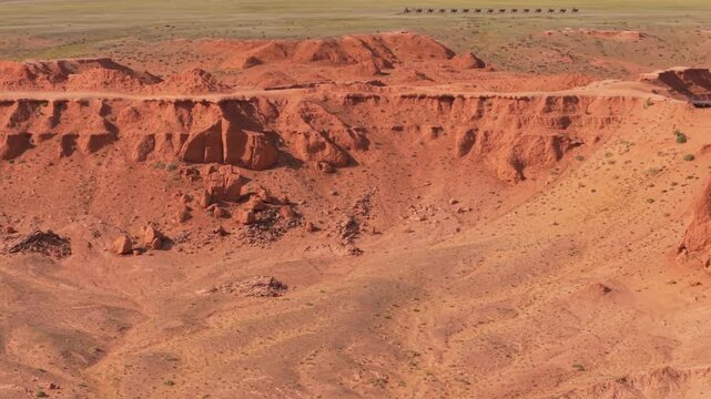 Drone parallax shot over the Flaming Cliffs canyon in the Gobi Desert, Mongolia