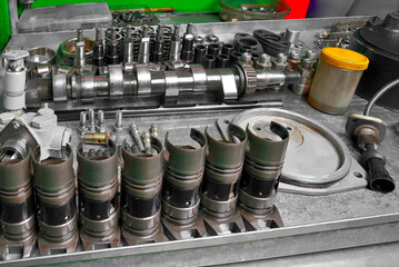 diesel engine fuel pump repair engine parts and components lying on a bench ready for installation