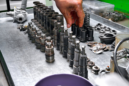 diesel engine fuel pump repair engine parts and components lying on a bench ready for installation