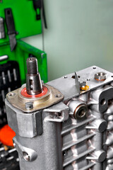 diesel engine fuel pump repair, installing camshaft in fuel pump mounted on workbench