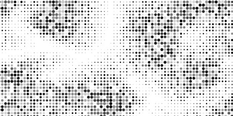 Fototapeta premium Abstract halfton background. A wave of black dots on a white background.