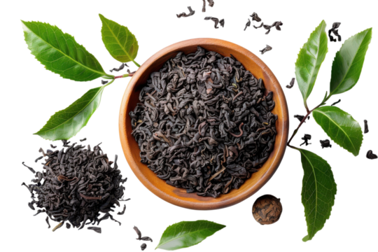 Loose leaf black tea in a wooden bowl with fresh green leaves on transparent background