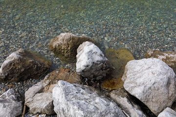 In Lochau, Austria, stones can be found in the shallow waters along the lakeshore