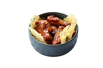 Delicious Fried Chicken Wings in a Dark Bowl, Garnished with Crispy Chips. A culinary masterpiece with perfectly cooked, mouth-watering chicken wings in a dark bowl, enhanced by crispy chips