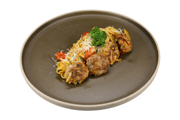 A delicious plate of spaghetti with meatballs, tomatoes, and cheese. It has a garnish of parsley, and it looks appetizing