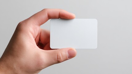 Showcase your brand with a blank card held by hand, perfect for displaying your logo or message with a modern and professional touch today