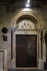 Jerusalem, Israel, The entrance to the Roman catholic church of the holy family or a related station of the cross on the via dolorosa, featuring a relief of christ meeting his mother, maria.