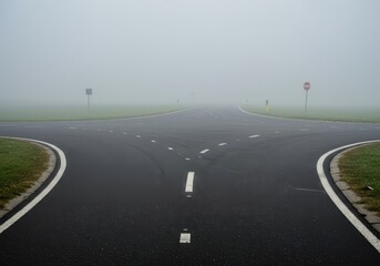 Fototapeta premium Ominous fog covers a complex asphalt intersection, forcing a critical choice between unknown pathways and emphasizing potential hazards, decision, fog, abstract