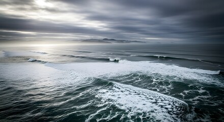 Dramatic Ocean Waves Under Cloudy Sky