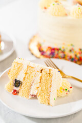 Cake with golden spatula and fruit layers