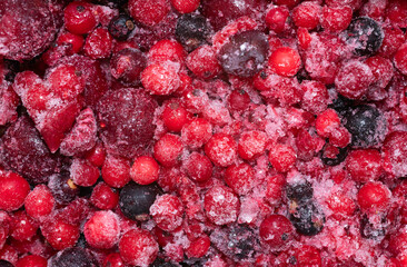 Close-up of many frozen different berries.