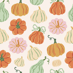 Vector seamless pattern with various hand-drawn pumpkins in soft autumn colors on light background. Farm, harvest, and Thanksgiving holiday design. Rustic fall vegetable print for textile, cover