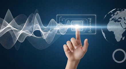 Finger touching glowing interface screen with digital globe and wave patterns technology