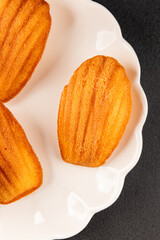 Madeleine cookies sweet dessert traditional french sweets tasty snack fresh delicious gourmet food background on the table rustic top view copy space