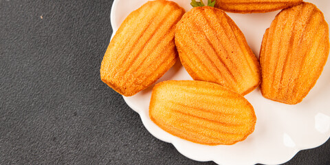 Madeleine cookies sweet dessert traditional french sweets tasty snack fresh delicious gourmet food background on the table rustic top view copy space