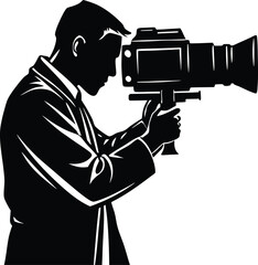 Silhouette of a cameraman holding a video camera filming