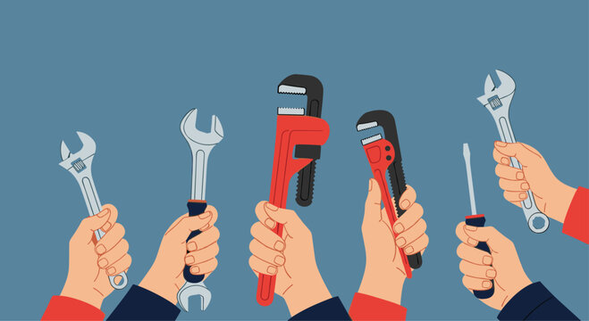 Diverse hands hold an assortment of essential tools like wrenches and a screwdriver, symbolizing repair, maintenance, and skilled labor.