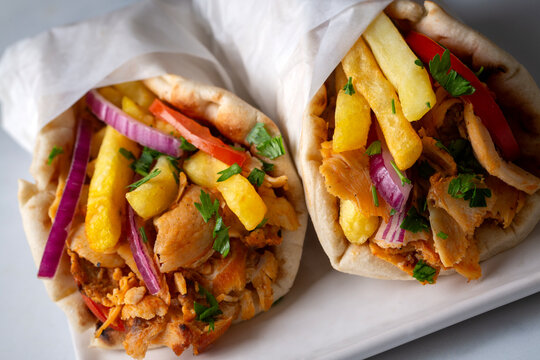 Greek chicken gyros wrapped in pita breads