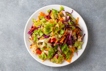 Turkish style lettuce salad. Diet salad with lettuce, red cabbage, tomatoes, and carrots.