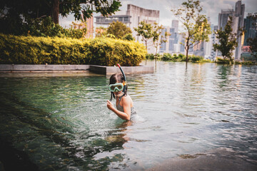 girl in the swimming pool in Kuala Lumpur, Malaysia