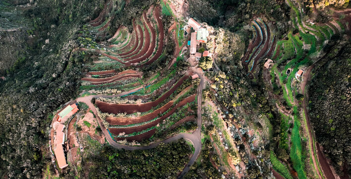 A landscape with a road and valleys among the mountains at sunset, the way to the Masca Gorge, Tenerife island.