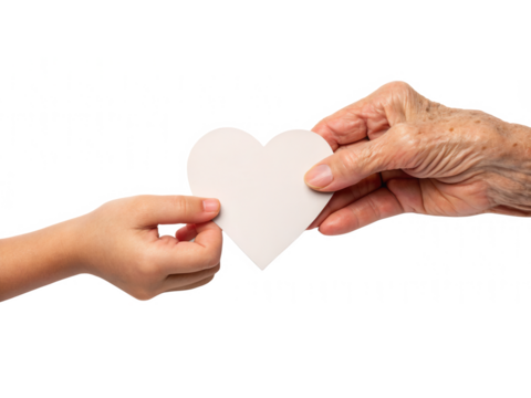 Two hands are exchanging a heart-shaped paper cutout, symbolizing love and connection across generations.