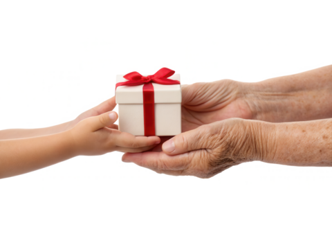A child and an elderly person's hands exchanging a small gift box adorned with a red ribbon.