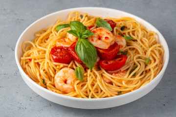 Delicious shrimp spaghetti with tomato sauce and parsley, Italian cuisine