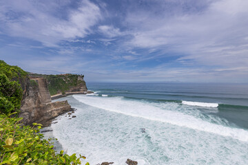 Beautiful ocean view with a cliff in the background