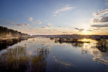 Calm lake with a beautiful sunset in the background