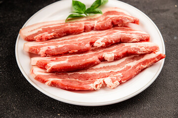 Bacon slice lard with meat slices pieces pork tenderloin portion size natural product tasty snack fresh delicious gourmet food background on the table rustic top view copy space
