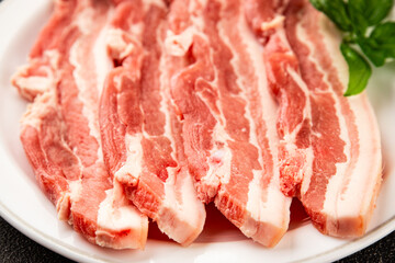 Bacon slice lard with meat slices pieces pork tenderloin portion size natural product tasty snack fresh delicious gourmet food background on the table rustic top view copy space